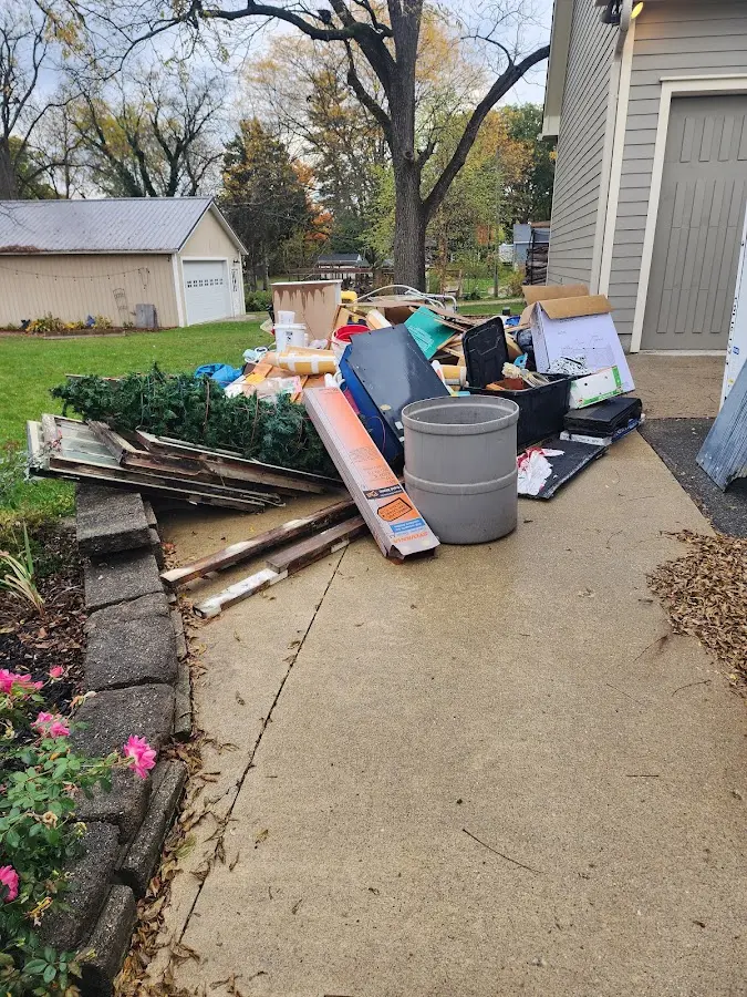 Dumpster being loaded with debris for Demolition Dumpster Rental in Haysville